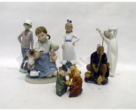 Lladro figure of a little girl with doll and kitten, Nao figures, a Chinese figure of a gentleman fishing and a group of thre