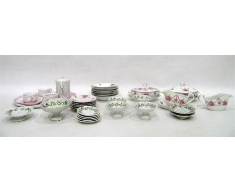 Miniature porcelain part dinner service, cream ground decorated with roses, a miniature part tea service comprising of teapot