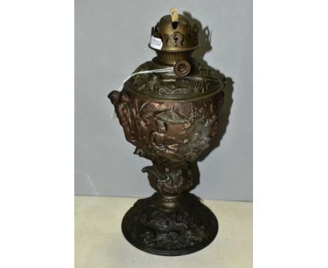 A LATE 19TH CENTURY BRONZED SPELTER OIL LAMP BASE, cast with Africans and Europeans to the base, glass reservoir, several cra