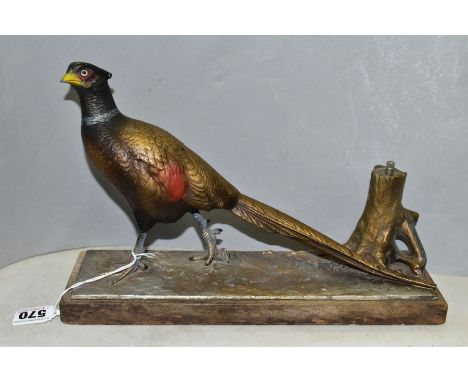 AN EARLY 20TH CENTURY PAINTED SPELTER TABLE LIGHTER IN THE FORM OF A COCK PHEASANT STANDING BY A TREE TRUNK, mounted on a rec