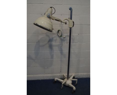A VINTAGE HANOVIA SOLLUX MODEL M800 FLOOR STANDING HEAT LAMP, cream finish, adjustable shade, and counter weighted height adj