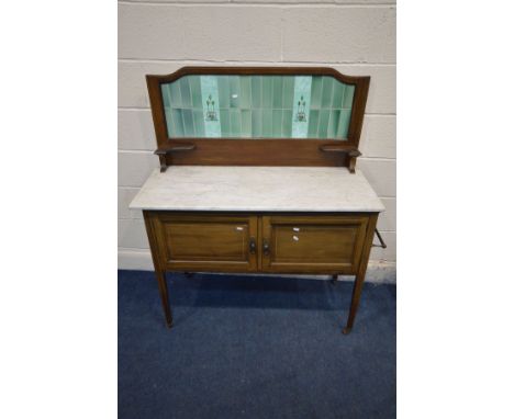 AN EDWARDIAN MAHOGANY AND STRUNG INLAID WASHSTAND, with an Art Nouveau tile back, and marble top, width 107cm x depth 46cm x 
