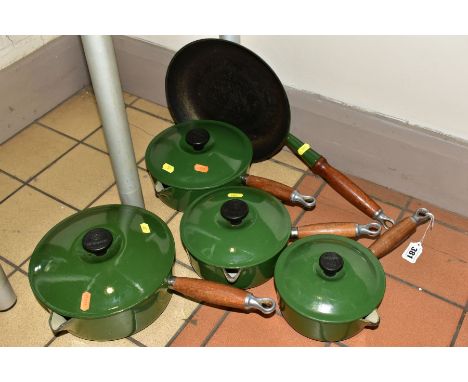 A LE CREUSET GRADUATED SET OF FOUR GREEN ENAMEL CAST IRON SAUCEPANS AND MATCHING FRYING PAN, comprising diameters 16cm, 18cm,