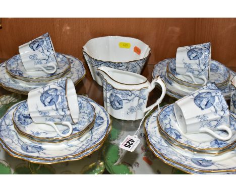 AN EARLY 20TH CENTURY WEDGWOOD BONE CHINA TEA SET, transfer printed with a blue and white aesthetic design of tree blossom an