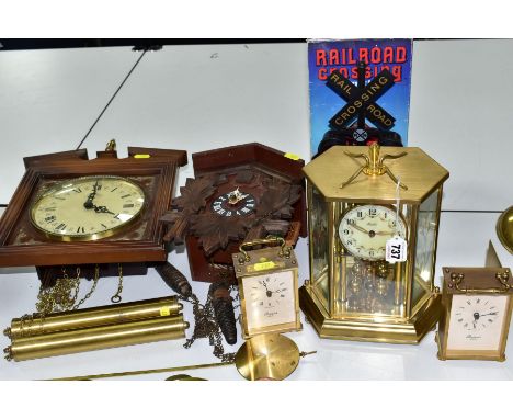 SIX 20TH CENTURY CLOCKS, comprising a Black Forest cuckoo clock with two pine cone weights, height 24.5cm, a German 'Annual' 