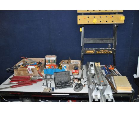 A DRAPER WORKMATE, a TRT aluminium tracked drill attachment wood turning lathe, a set of wood turning chisels, hole punches, 