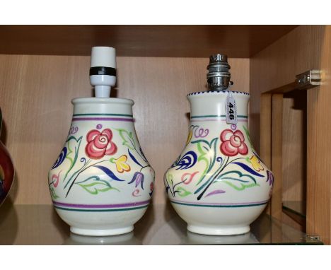 TWO POOLE POTTERY TABLE LAMPS OF BALUSTER FORM, both hand painted with flowers on a white ground, printed and painted marks, 