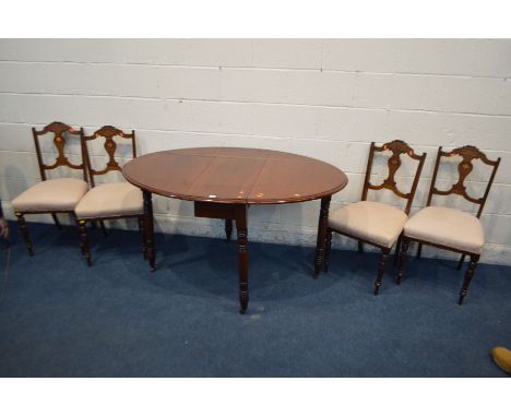 A VICTORIAN WALNUT OVAL GATE LEG TABLE on turned legs and brass casters, open depth 137cm x closed depth 36cm x length 98cm x