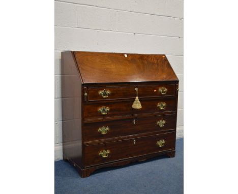 A GEORGIAN MAHOGANY BUREAU, with fitted interior comprising an assortment of satin birch drawer fronts and compartments, four