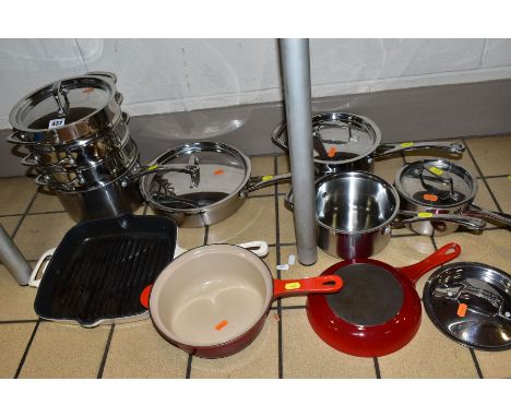 A SET OF LE CREUSET STAINLESS STEEL COOKWARE AND THREE PIECES OF ENAMELLED COOKWARE, comprising a Le Creuset 24cm 2.9L frying