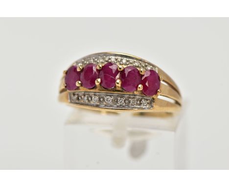A 9CT GOLD RUBY AND DIAMOND RING, of a half hoop design, set with a row of five raised, oval cut rubies (possibly fracture fi