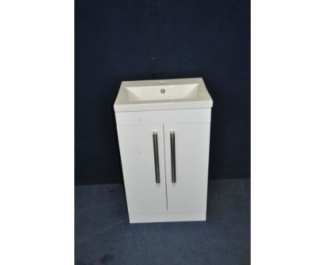 AN AMS PLUMBING WC SINK UNIT with a shallow ceramic sink standing on a white hi gloss two door cabinet,  brushed stainless ba