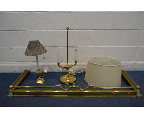 A BRASS EXTENDING FENDER, along with a brass twin branch table lamp with oval shade, and a another table lamp (3) (Condition 