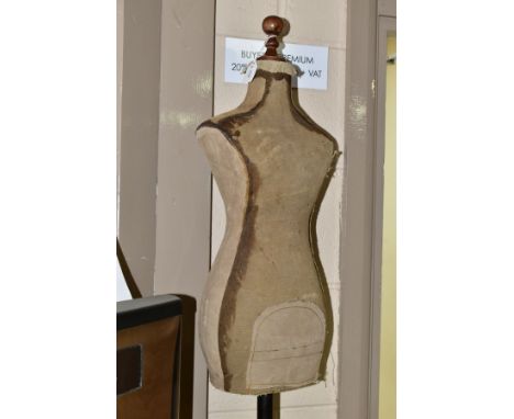 A VINTAGE CHILD SIZED SHOP MANNEQUIN, canvas covered body mounted onto a metal pole on cast metal base, approximate height 10