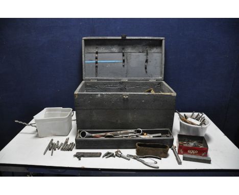 A VINTAGE WOODEN TOOLBOX containing a large quantity of engineering tools including dividers, milling cutters, lathe cutters,