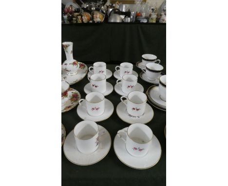 A Set of Eight Floral Patterned Royal Worcester Coffee Cans and Saucers 