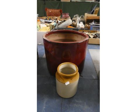 A Red Glazed Cylindrical Planter and a Treacle Glazed Jar, Planter 37cm Diameter 