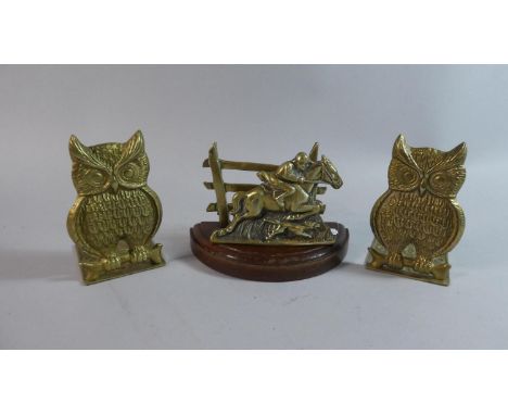 A Pair of Cast Brass Bookends in the Form of Horned Owls , 14cm high, Together with a Brass Stationery Rack in the Form of Hu