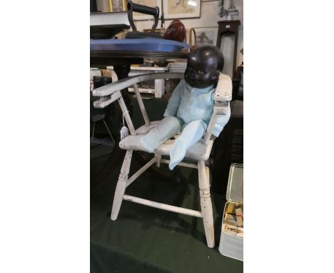 A White Painted Child's Commode Chair and Black Faced Doll 