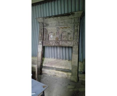 Very large oak fire surround, probably mid 19th Century frame with additional older carvings in the Jacobean style, to create
