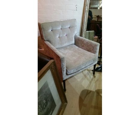 Plush oyster grey chair, button backed (multi coloured buttons), dark wood legs with brass castors, minor fabric damage, used