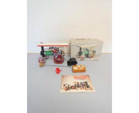 A boxed Mamod TE1A Steam Tractor with accessories and booklet.