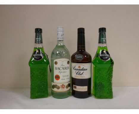 CANADIAN CLUB blended whisky 40% abv. 70cl, BACARDI white rum 37.5% abv 1litre and two bottles of MIDORI Suntory melon liqueu