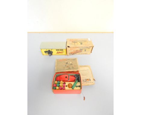 Schuco. Two boxed vintage diecast models comprising of Telesteering Car no.3000, and Garage no.1500 with red clockwork car no