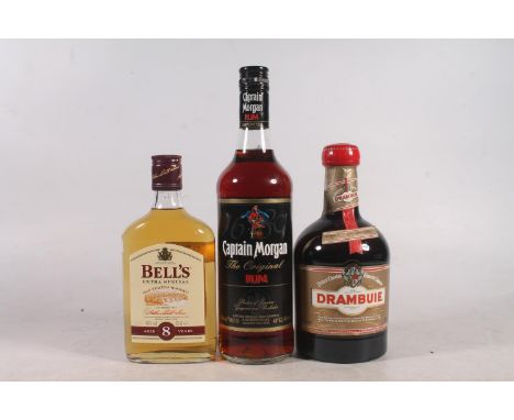 Three bottles of alcohol to include DRAMBUIE whisky liqueur 40% abv. 70cl, BELLS 8 year old blended Scotch whisky 40% abv. 35