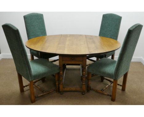 Golden oak oval drop leaf dining table with turned gate legs and single drawer (166cm x 123cm, H75cm) together with a set of 