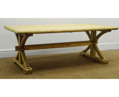 Light timber planked coffee table, shaped supports joined by single stretcher on sledge feet, W130cm, H50cm, D70cm Condition 