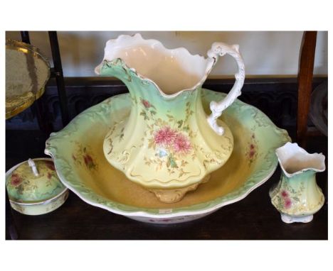 Late 19th/early 20th pottery jug and basin set with transfer decoration of flowers and further accessories  