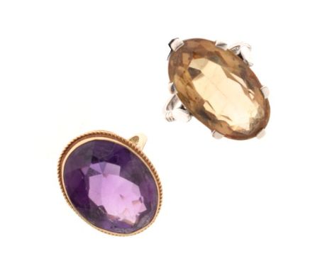 9ct gold dress ring set large oval amethyst-coloured stone, size O, 6.4g gross approx, together with a silver dress ring (2) 