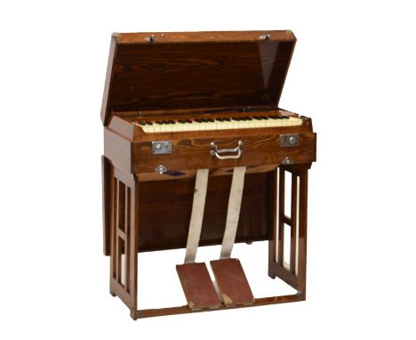 Mid 20th Century oak cased 'Pearl River' travelling harmonium having chromed mounts, having folding base, the whole fitting n