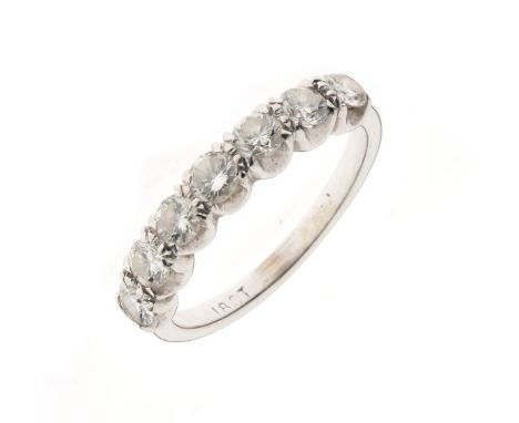 White metal and seven stone diamond half hoop eternity ring, the uniform brilliants totalling approximately 1ct, the mount st