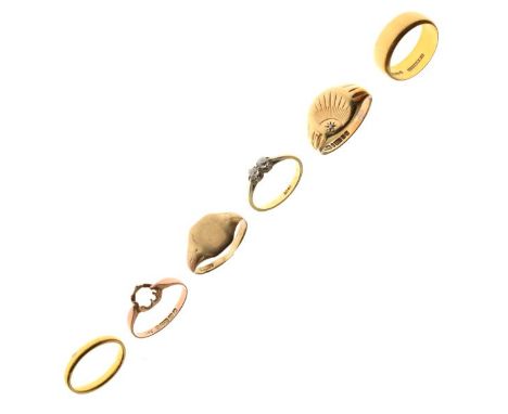 Six assorted gold and yellow metal rings comprising: 22ct gold wedding band, 5.8g, size M½, another, 3.1g, size L, yellow met