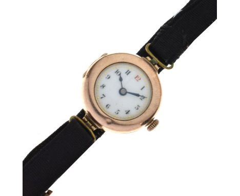 Lady's 9ct gold cased wristwatch, the white enamel dial with Arabic numerals on black fabric strap  