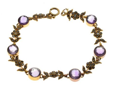 Unmarked yellow metal, seed pearl and amethyst-coloured stone set bracelet of interspersed stones and flowering plants, 21.5c