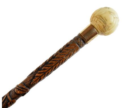 19th Century carved walking stick, decorated with thistles and shamrock, carved ivory pommel handle, 90cm long  