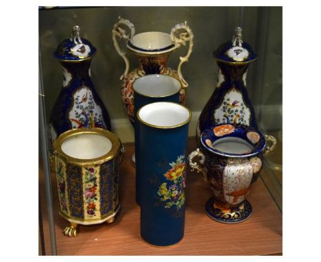 Pair of scale blue vases in the Worcester manner, each with seated dog finial, 28cm high, together with two Derby-style vases