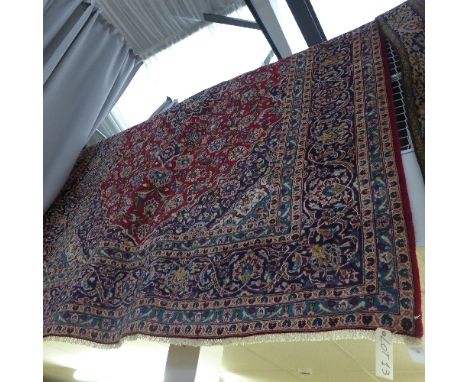 An extremely fine central Persian Kashan carpet 355 cm x 260 cm, central pendant medallion repeating Shah Abass on a rouge fi