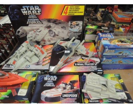 A large selection of boxed Star Wars vehicles by Kenner including Milenium falcon, X wing, Landspeeder, Cloud car, Air speede