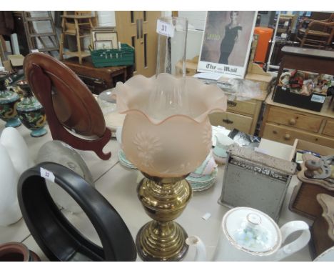 A vintage brass oil burner lamp by Duplex with opaque pink shade