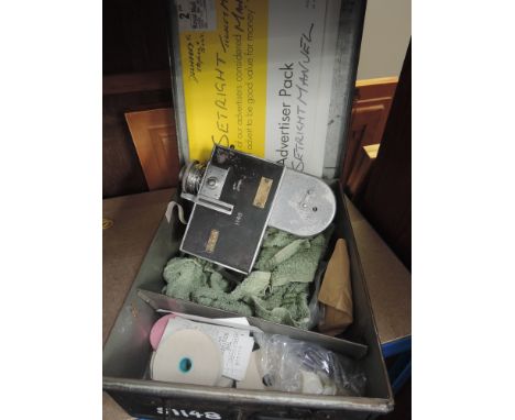 A SetRight bus conductors ticket machine, serial number 18037 in tin with tickets and another tin with spare ticket reels