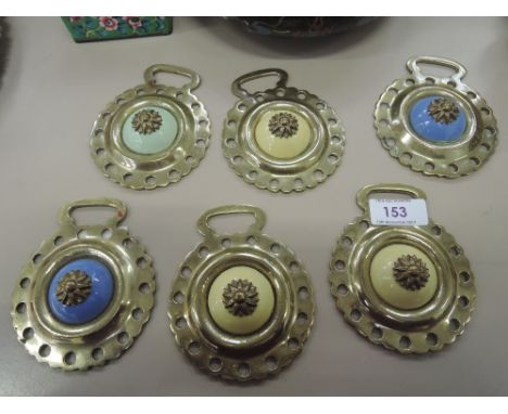 A selection of vintage brass and enamel ceramic horse brasses 