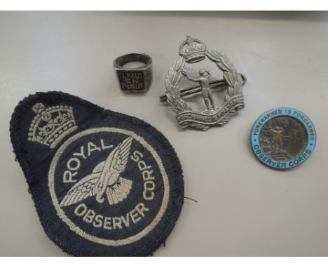 A selection of Royal Observer Corps badges and patch including unusual 'Il Faut En Finir' Ring