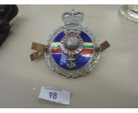 A vintage cast and enamel car badge reading 'Per Mare Per Terram' Rayal Marine military related 