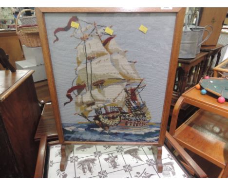 A vintage oak frame tapestry firescreen