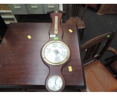 A vintage style wall mounted barometer 