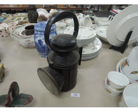 A vintage Railway track lines man oil burning lamp Tin body marked LMS London Midland Scotland with red and bevel glass